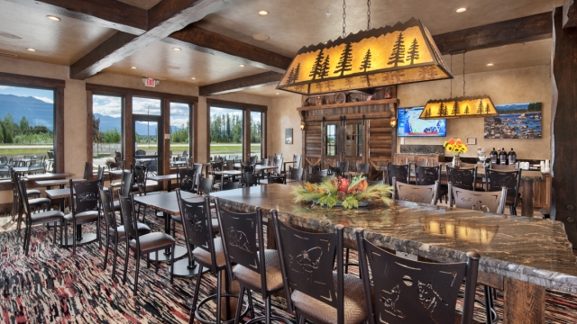 Interior, horizontal, breakfast room looking toward servery (doors closed) and windows with mountain view, Country Inns & Suites, Kalispell, Montana; Greg Bain & Company kalispell builder country inn dining area