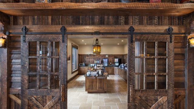 Interior, horizontal, looking into servery through barn doors, Country Inns & Suites, Kalispell, Montana; Greg Bain & Company kalispell builder country inn dining entry