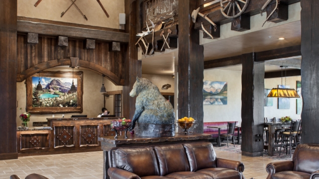 Interior, vertical, lobby looking toward sitting area, registration desk and breakfast room, Country Inns & Suites, Kalispell, Montana; Greg Bain & Company kalispell builder country inn lobby