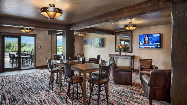 Interior, horizontal, second floor lounge looking out to outdoor patio and mountain view, Country Inns & Suites, Kalispell, Montana; Greg Bain & Company kalispell builder inn lounge