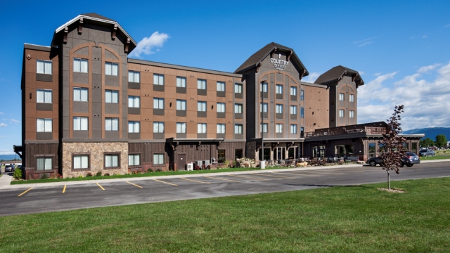 Exterior, horizontal, east facade overall, Country Inns & Suites, Kalispell, Montana; Greg Bain & Company montana builder greg bain airport hotel